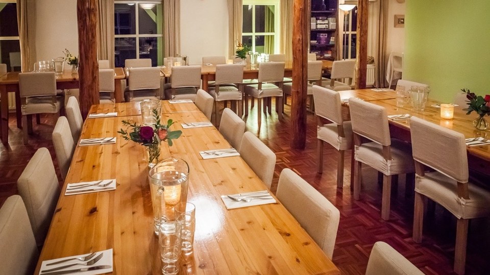 The dining room with its central log fire