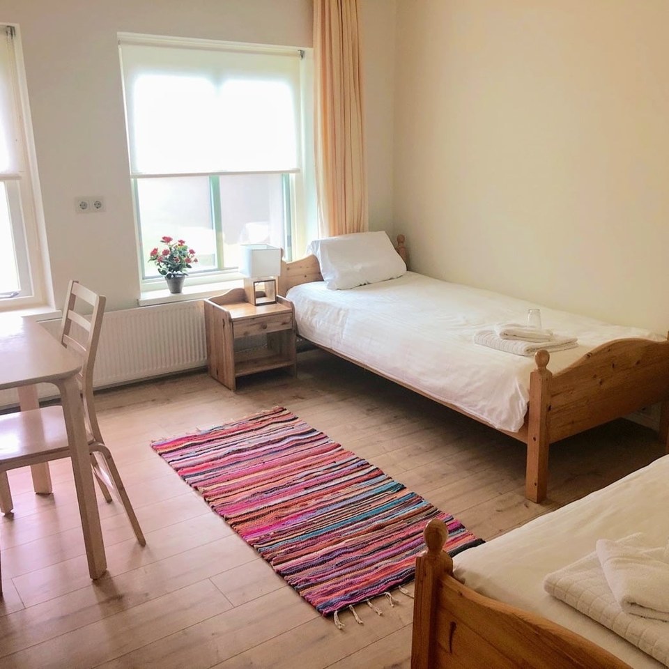 A calm en-suite guest bedroom in the Temple