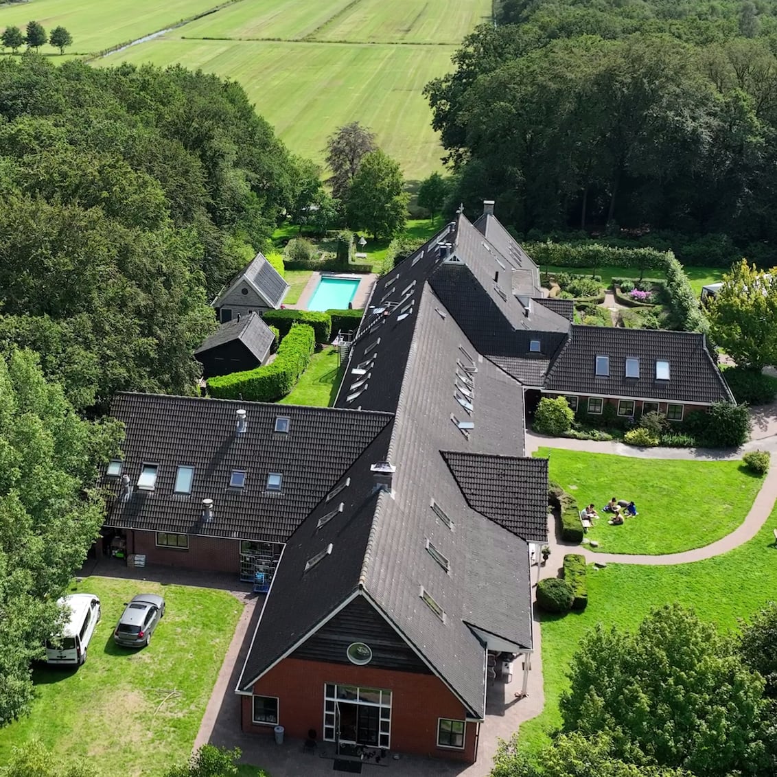Aerial view of the New Eden estate surrounded by forest